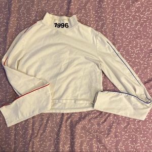 white mock neck long sleeve crop top